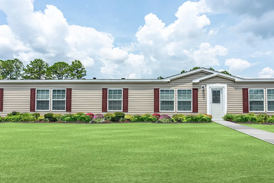 Big Kahuna manufactured home exterior with red shutters