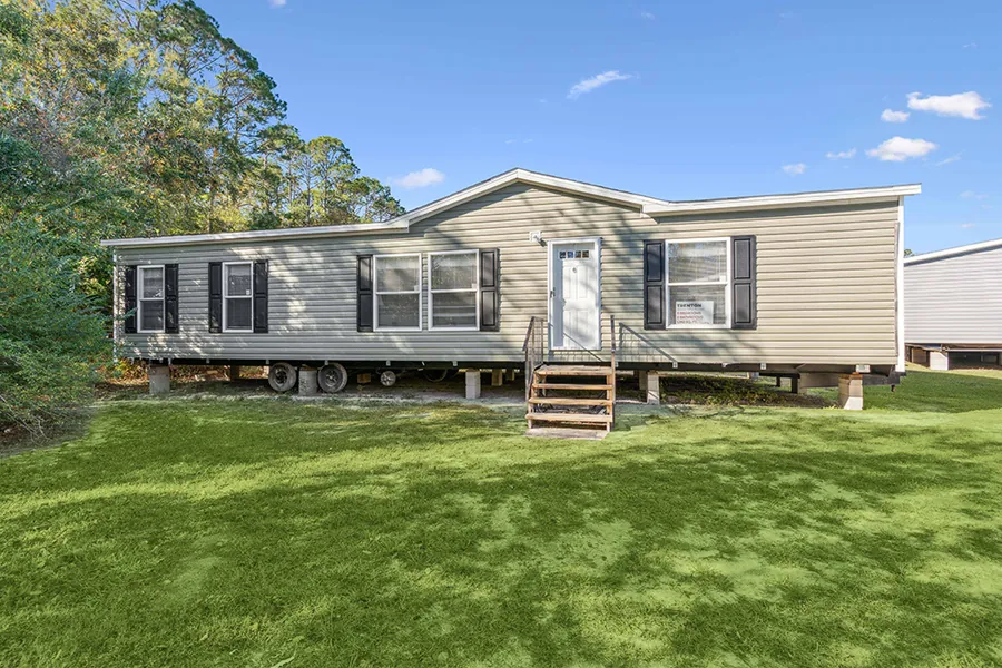 Trenton manufactured home exterior on a green lawn