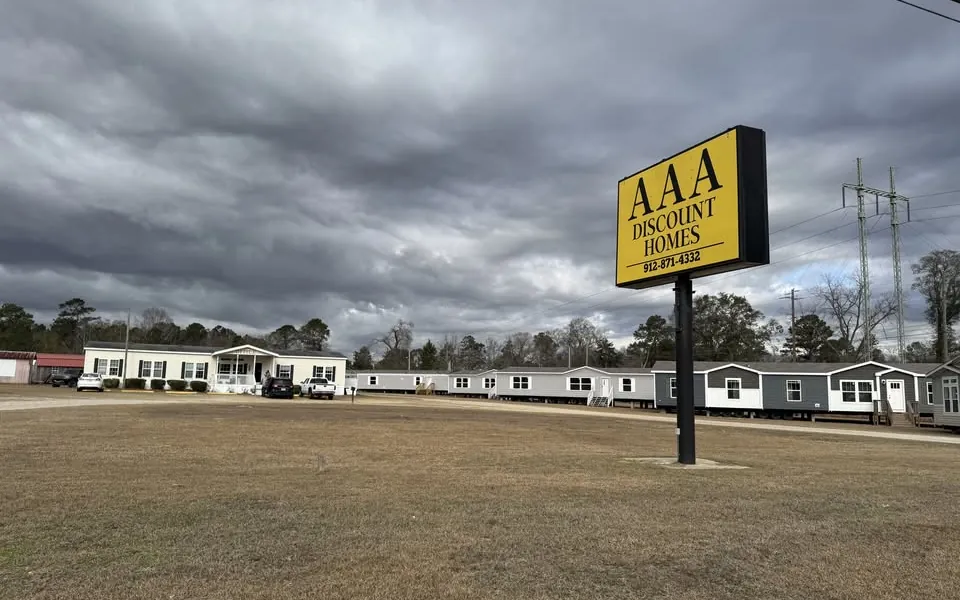 The AAA Discount Homes lot on US Highway 301 South, with the yellow AAA sign and rows of homes on display